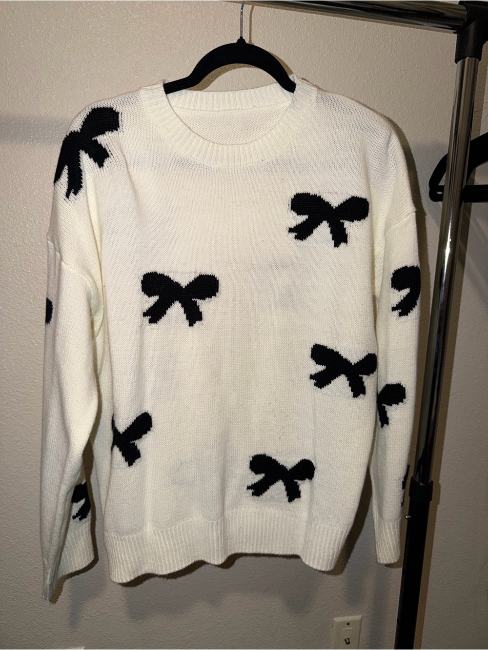 Classic White Crewneck Sweater with Black Bows